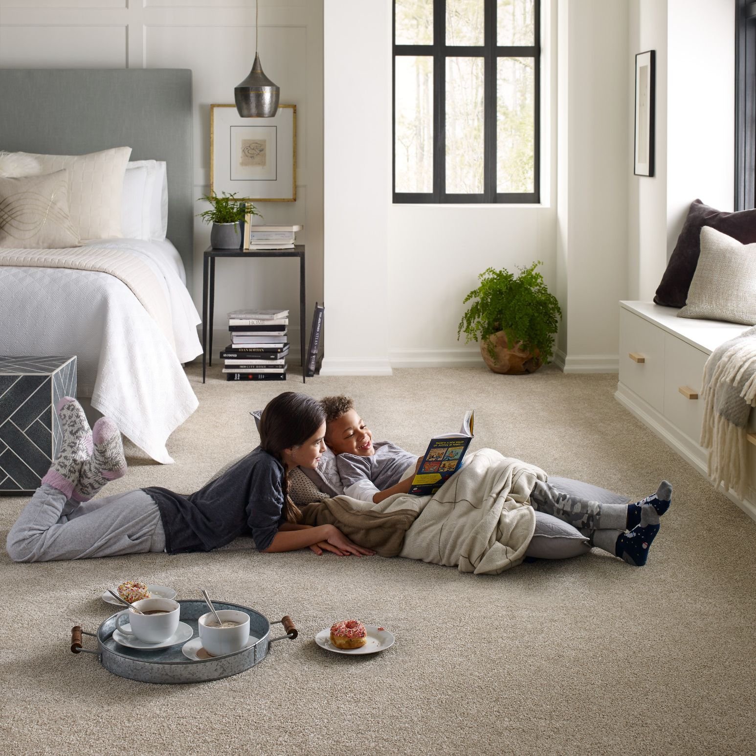 Kids reading on bedroom carpet from Simonian Flooring Inc in Village, NV